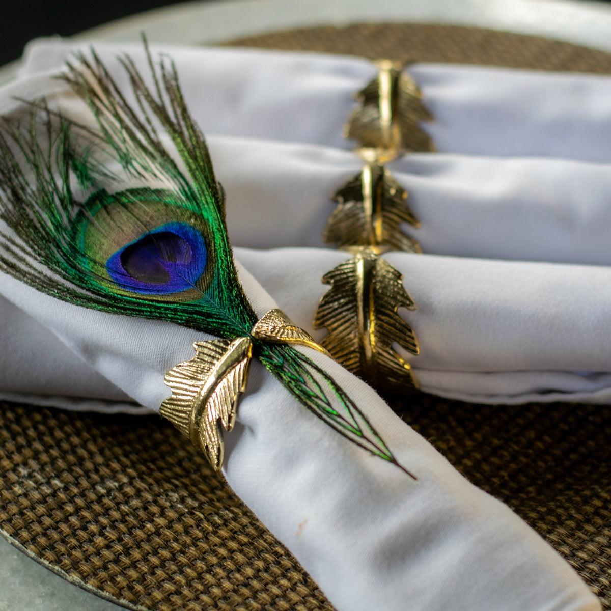 Set Of Four Golden Feather Napkin Rings